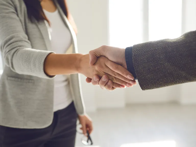 Close up of two people shaking hands